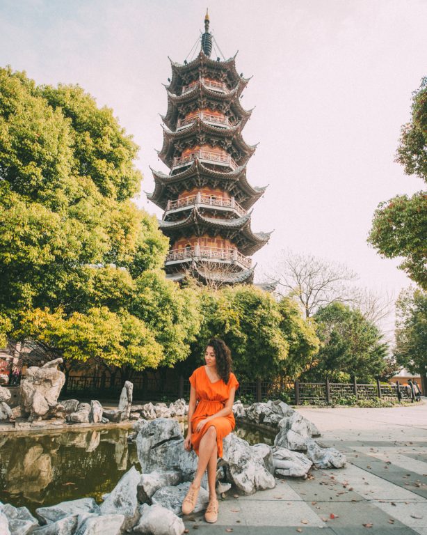 Longhua temple pagoda Shanghai women in orange dress
