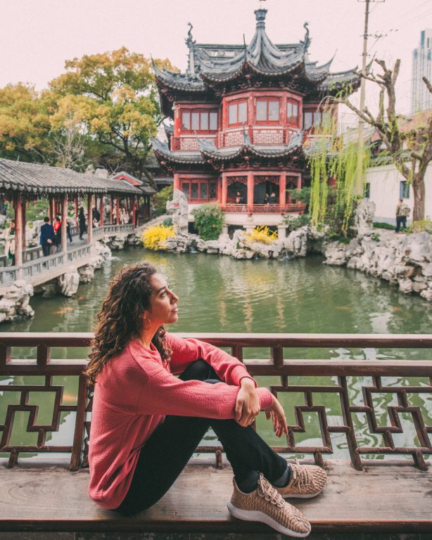 Yu garden architecture chinese women with pink sweater