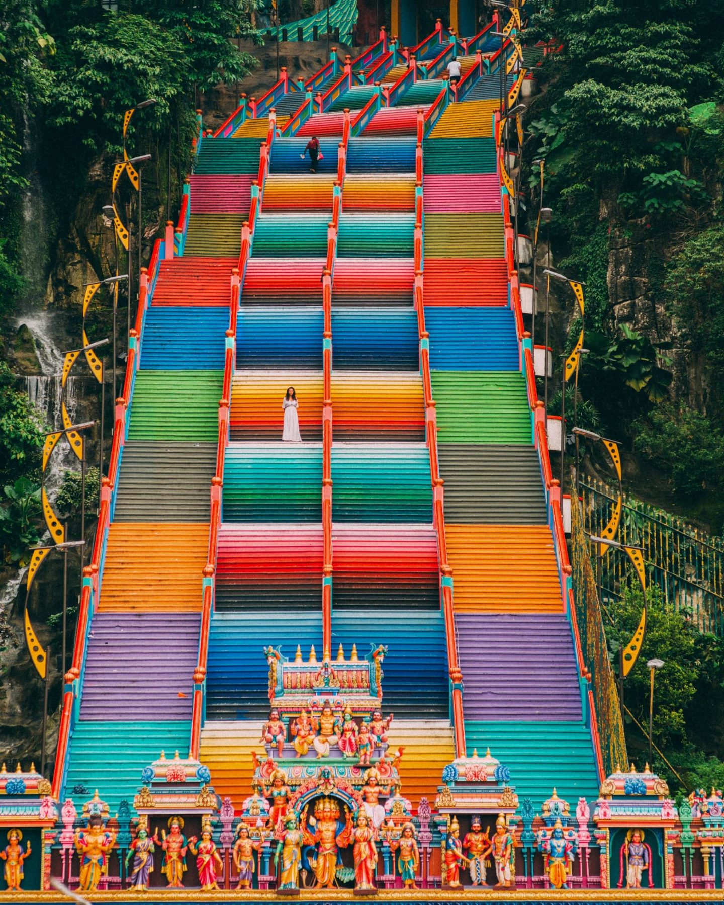 women at the rainbow stairs in the Batu caves